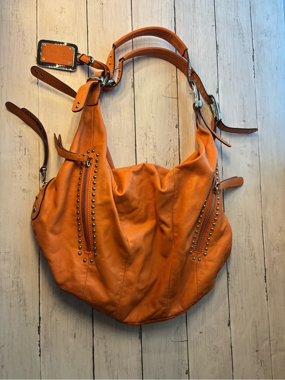 B. Makowsky Orange Studded Leather Hobo Bag